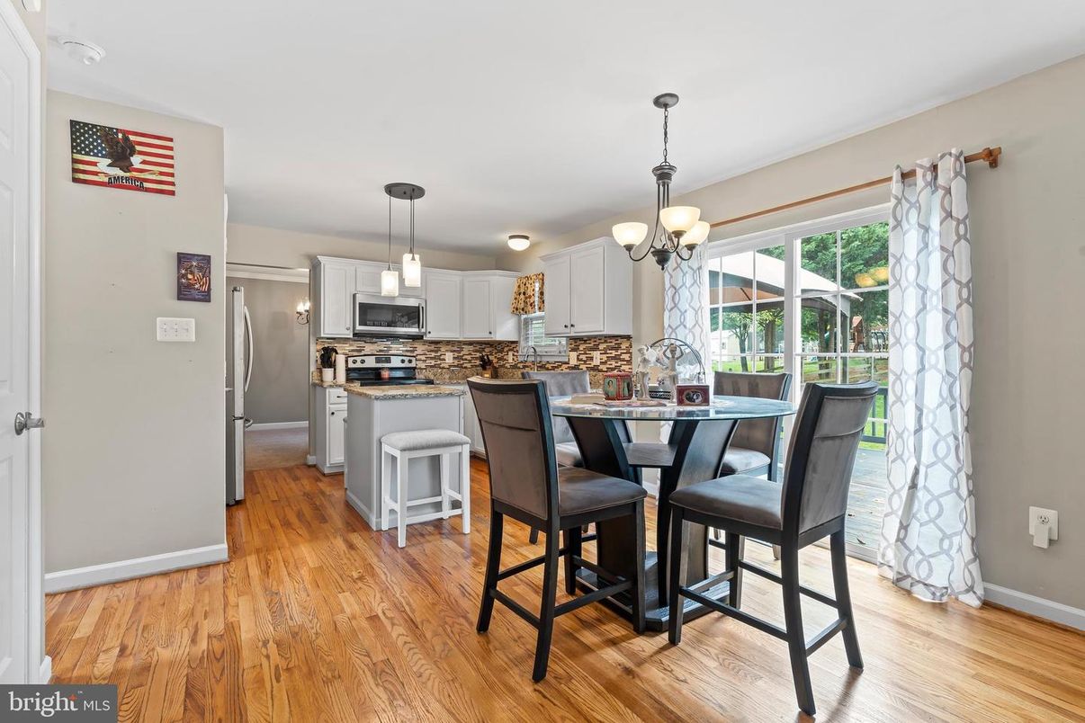 Chandelier, Dining room, Interior, Kitchen, Pendant Lights, Stainless Steel Appliances, Wood Texture Flooring