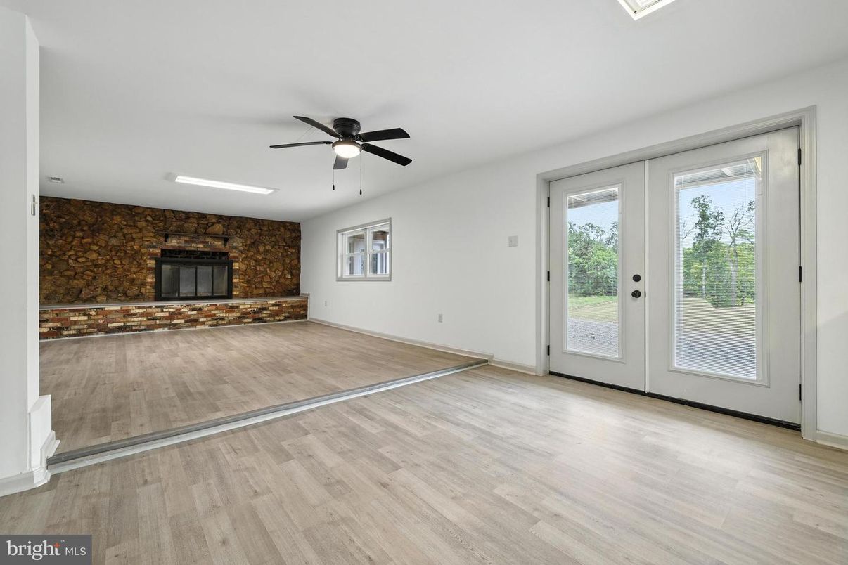 Empty room, Fireplace, Interior, Stone Walls, Wood Texture Flooring