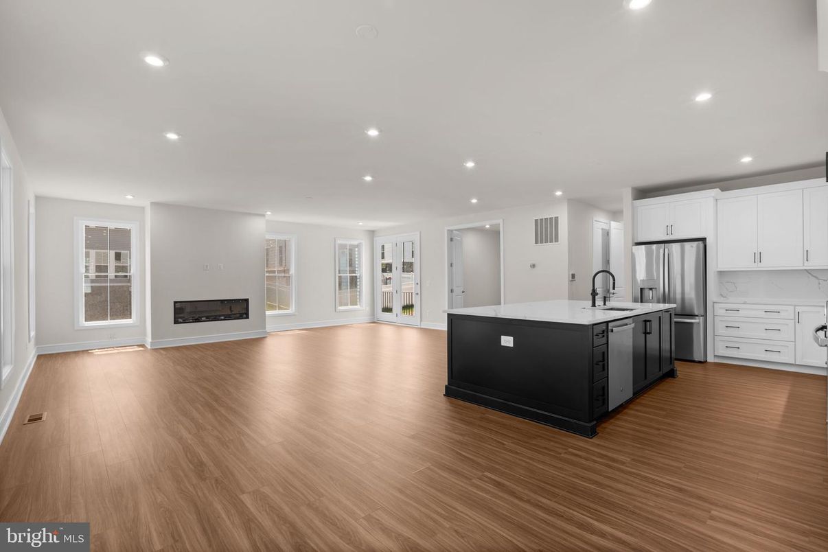 Empty room, Fireplace, Interior, Kitchen, Recessed Lighting, Wood Texture Flooring