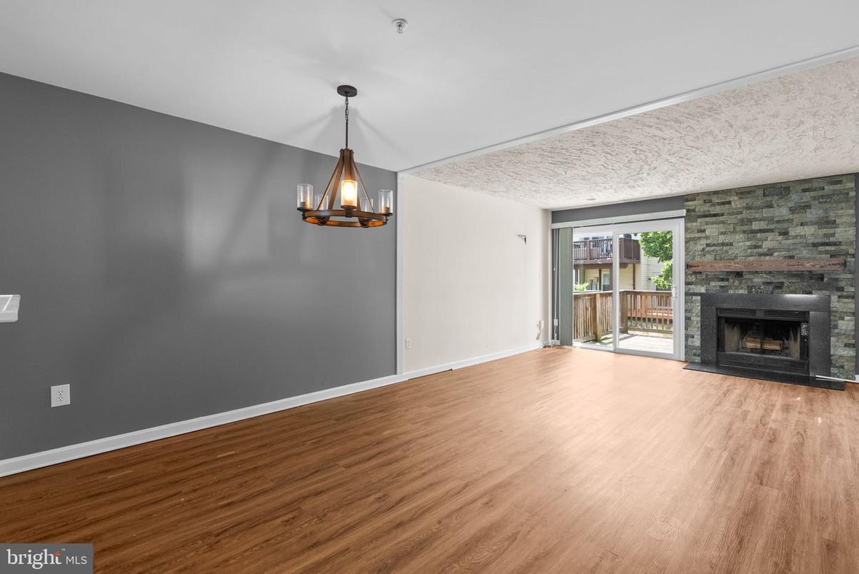 Empty room, Fireplace, Interior, Pendant Lights, Stone Walls, Wood Texture Flooring