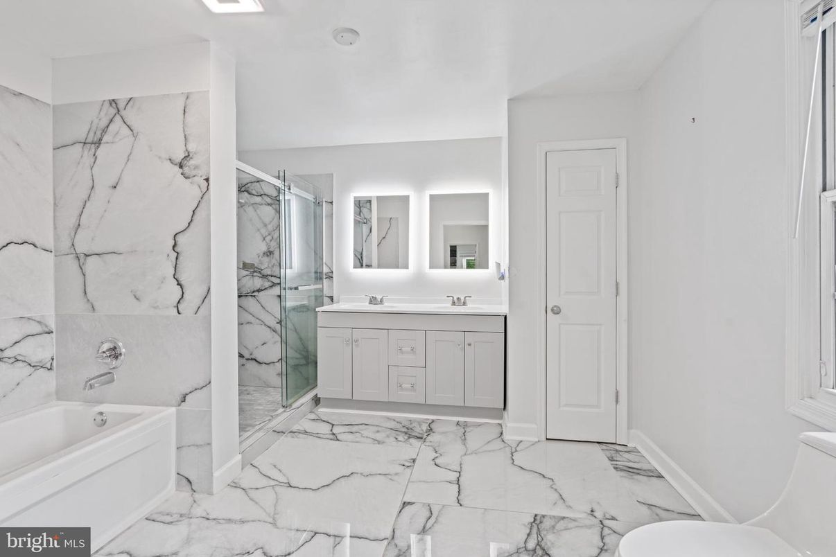 Bathroom, Dual Sink Vanities, Glass Shower, Interior, Marble, Marble Walls, Recessed Lighting