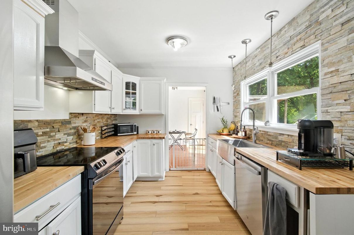 Interior, Kitchen, Pendant Lights, Stainless Steel Appliances, Stone Walls, Wood Texture Flooring