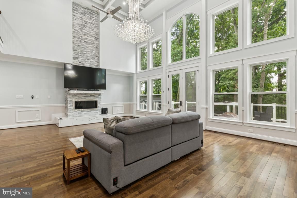 Chandelier, Fireplace, Interior, Living room, Sun Room, Wood Texture Flooring