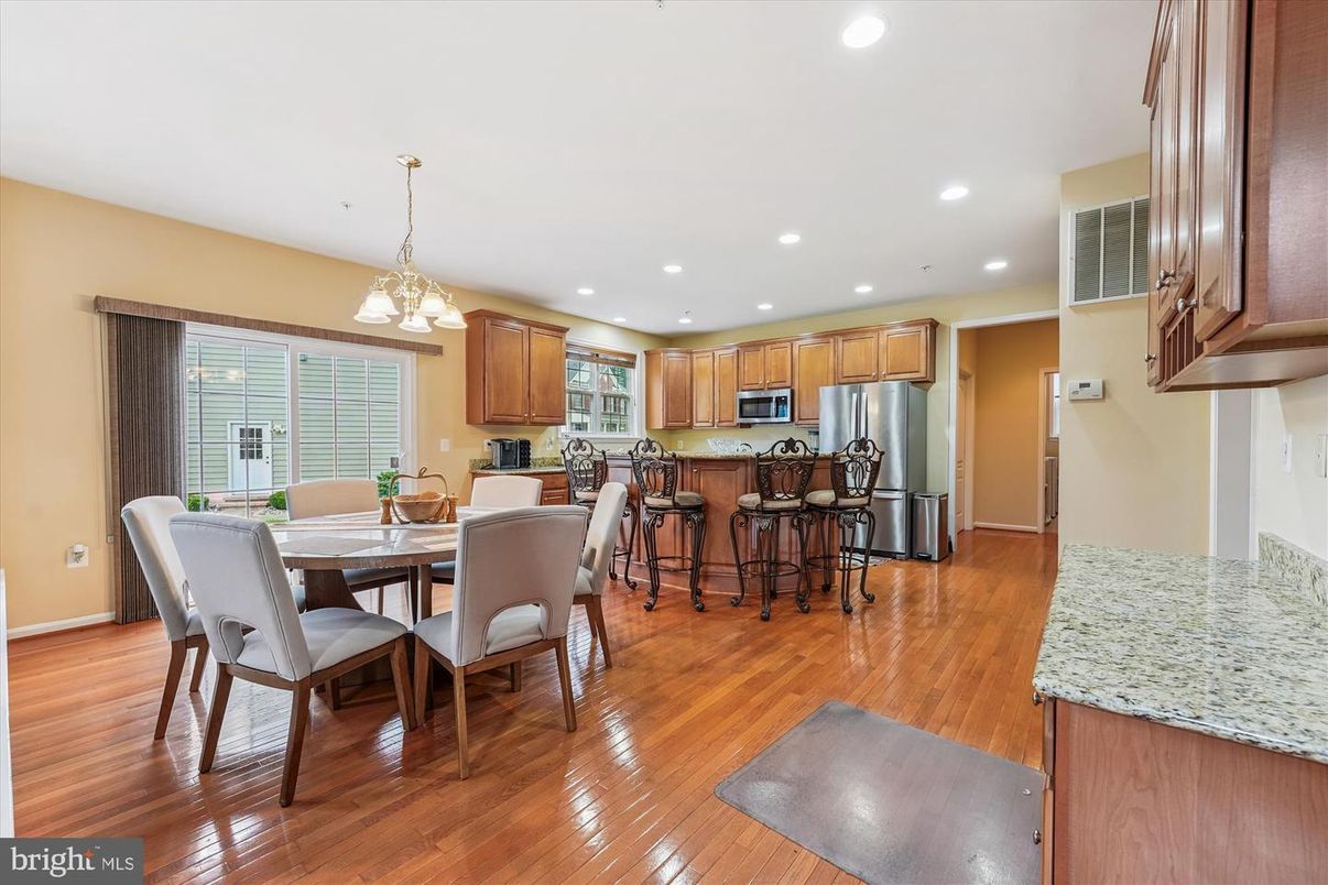 Dining room, Interior, Kitchen, Pendant Lights, Recessed Lighting, Stainless Steel Appliances, Wood Texture Flooring