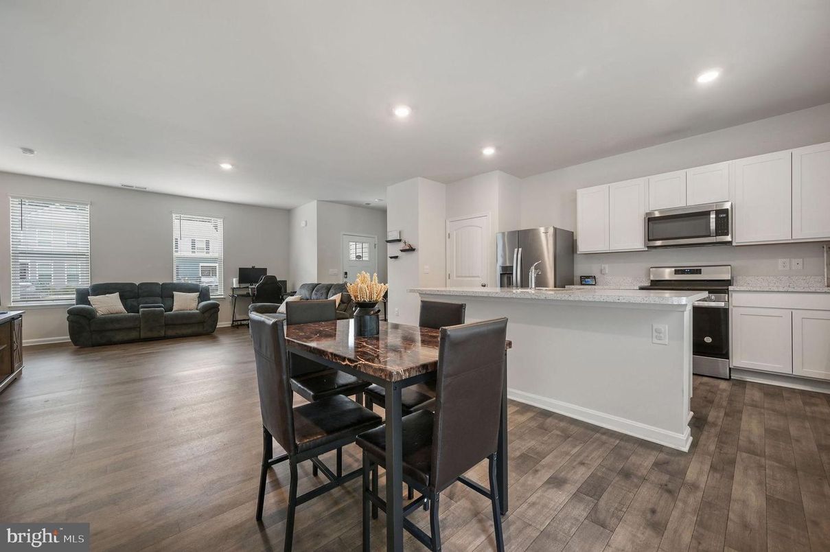 Dining room, Interior, Kitchen, Living room, Recessed Lighting, Stainless Steel Appliances, Wood Texture Flooring
