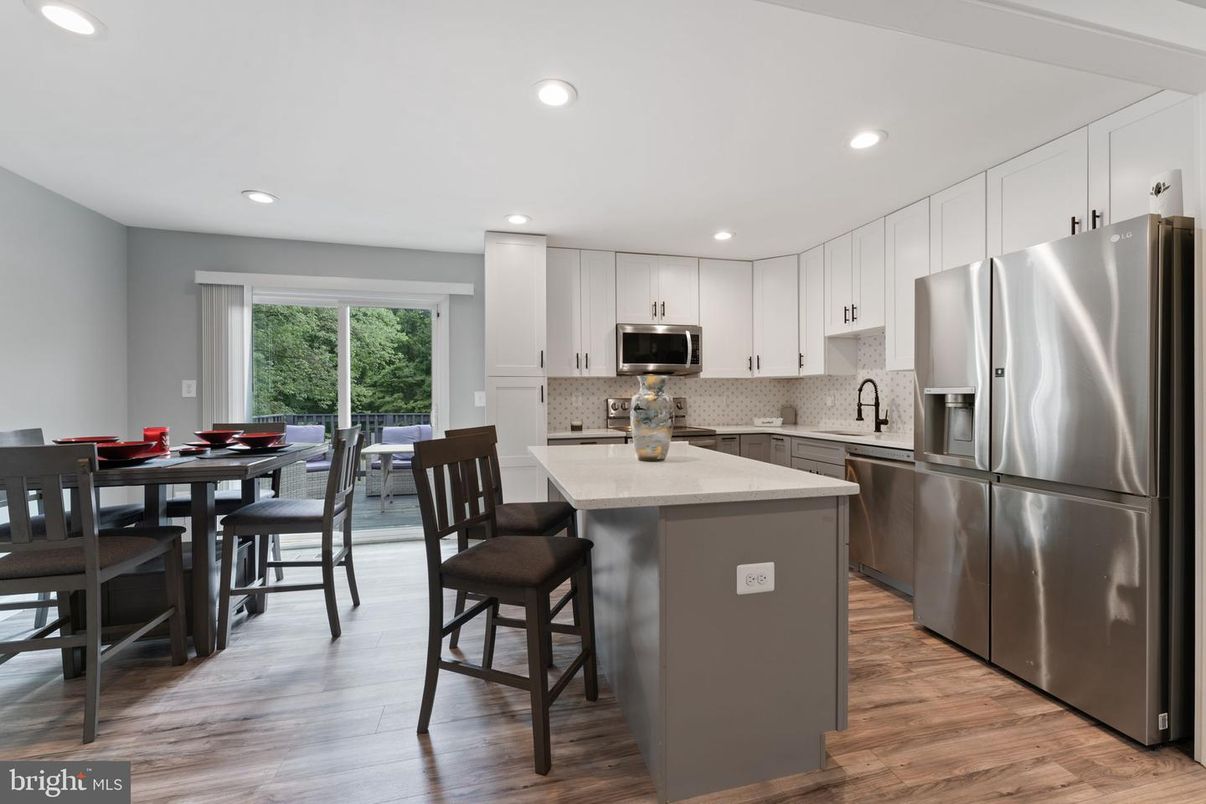 Dining room, Interior, Kitchen, Recessed Lighting, Stainless Steel Appliances, Wood Texture Flooring