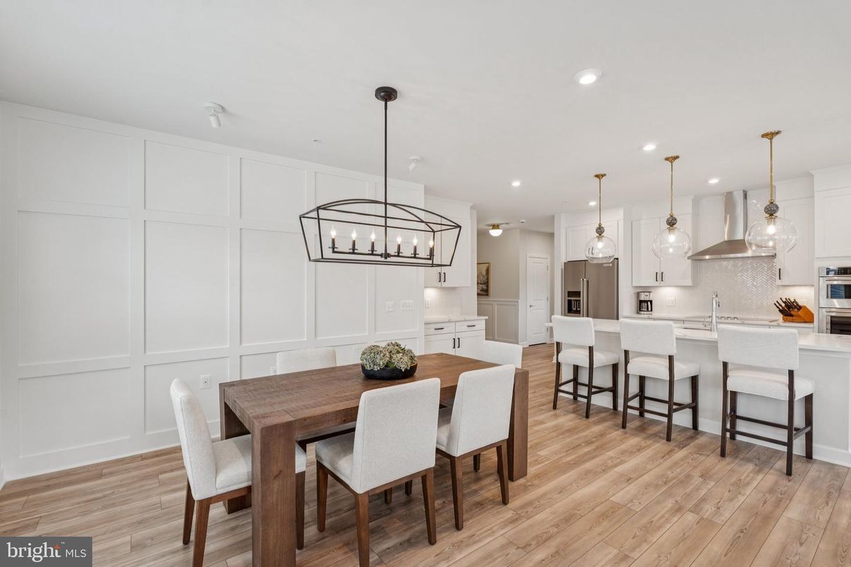 Dining room, Interior, Kitchen, Pendant Lights, Recessed Lighting, Stainless Steel Appliances, Wood Texture Flooring
