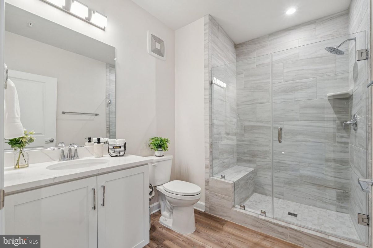 Bathroom, Dual Sink Vanities, Glass Shower, Interior, Recessed Lighting, Wood Texture Flooring