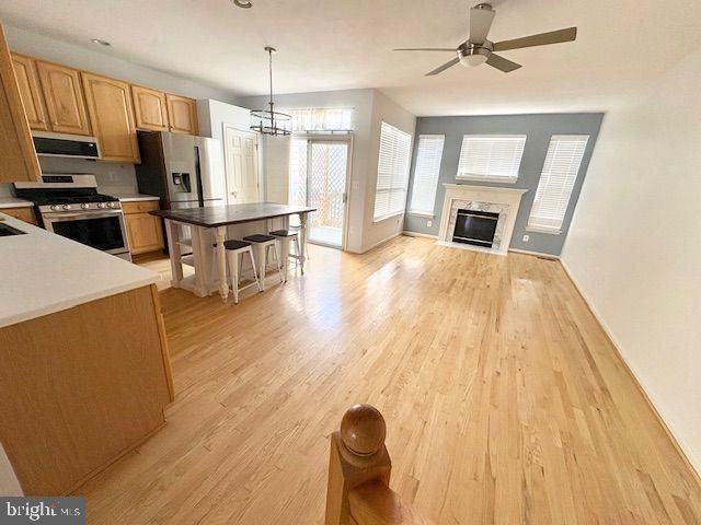 Chandelier, Dining room, Fireplace, Interior, Kitchen, Pendant Lights, Wood Texture Flooring