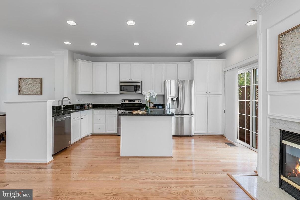 Fireplace, Interior, Kitchen, Recessed Lighting, Stainless Steel Appliances, Wood Texture Flooring