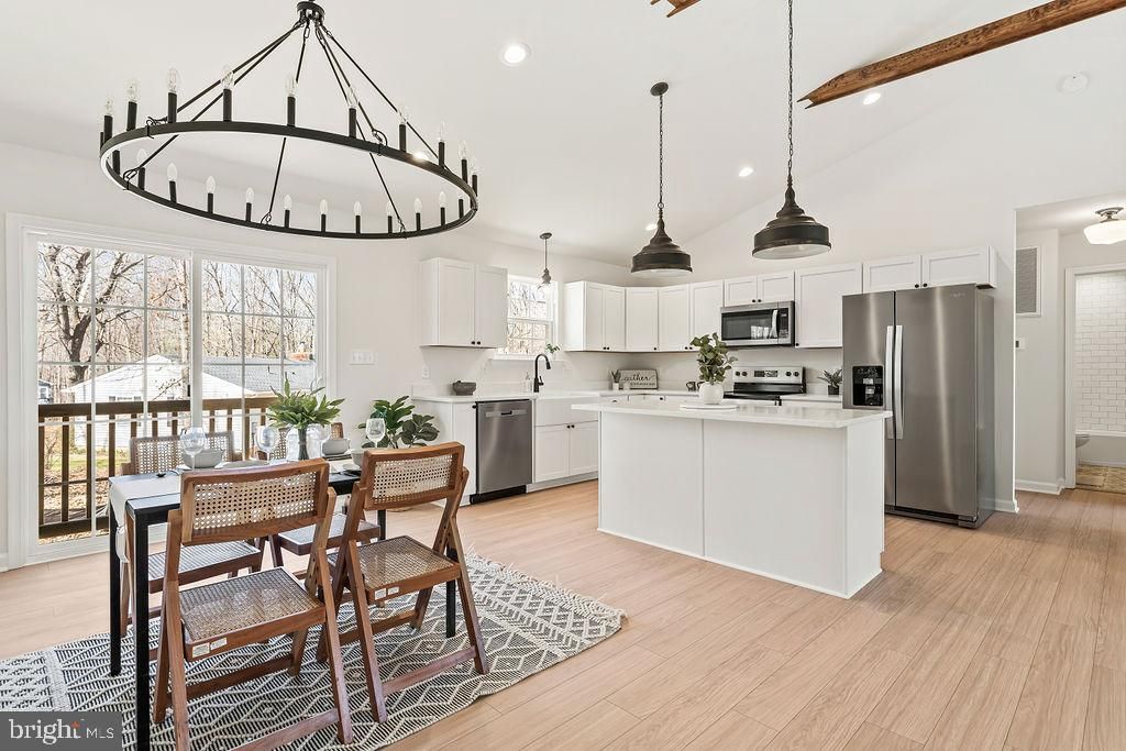 Dining room, Interior, Kitchen, Pendant Lights, Recessed Lighting, Stainless Steel Appliances, Wood Texture Flooring