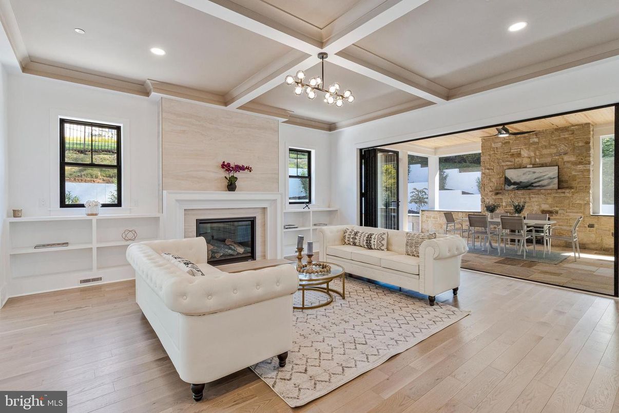 Dining room, Fireplace, Interior, Living room, Recessed Lighting, Stone Walls, Wood Texture Flooring