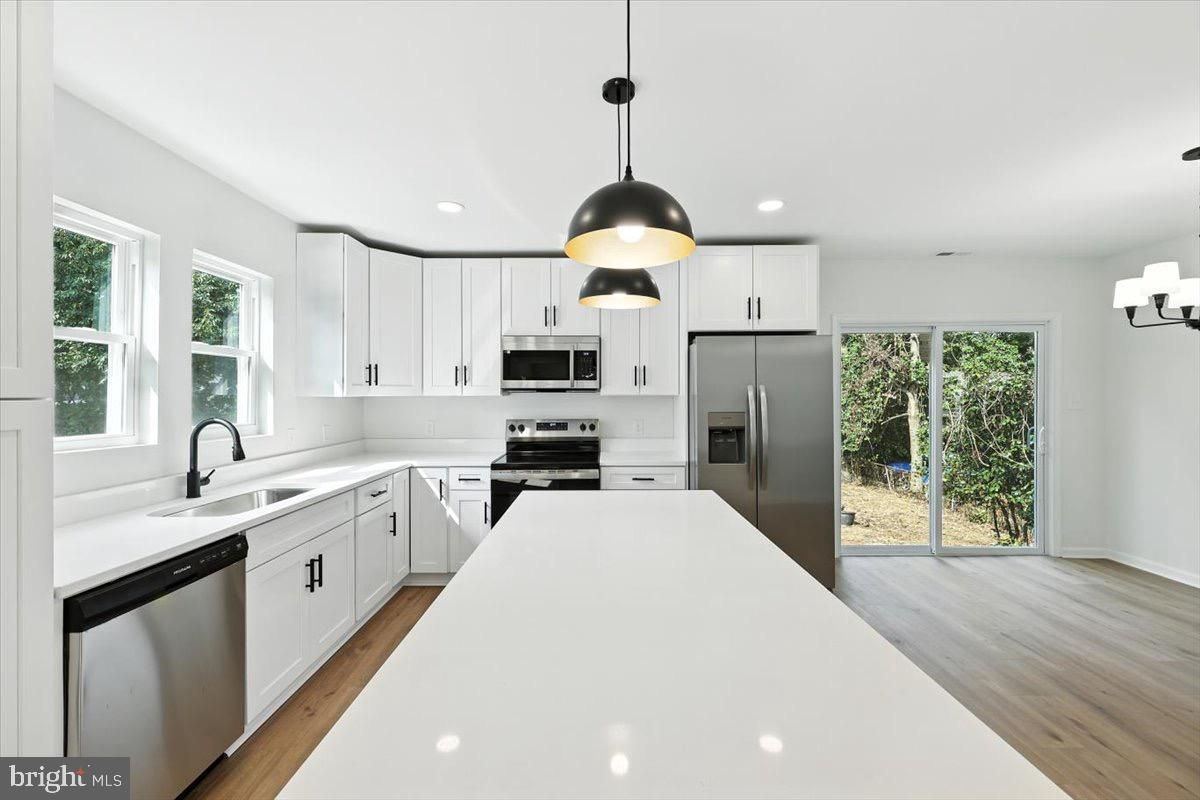 Interior, Kitchen, Pendant Lights, Recessed Lighting, Stainless Steel Appliances, Wood Texture Flooring