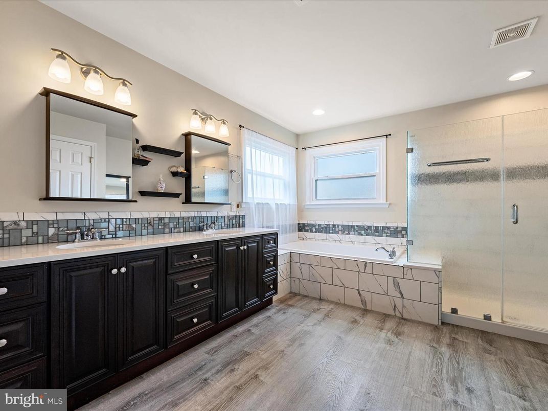 Bathroom, Dual Sink Vanities, Glass Shower, Interior, Recessed Lighting, Wood Texture Flooring