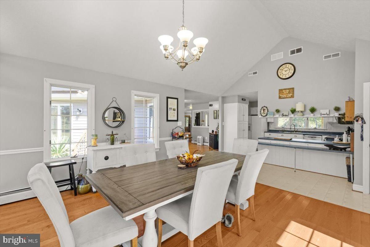Chandelier, Dining room, Interior, Kitchen, Stainless Steel Appliances, Wood Texture Flooring