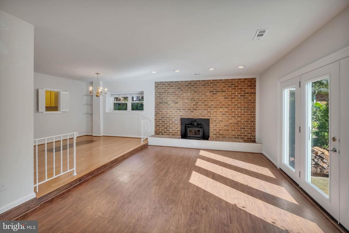 Empty room, Fireplace, Interior, Recessed Lighting, Stone Walls, Wood Texture Flooring