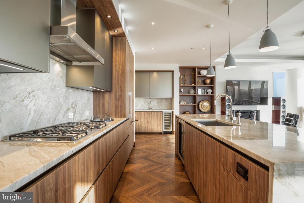 Interior, Kitchen, Marble Walls, Pendant Lights, Recessed Lighting, Stainless Steel Appliances, Wood Texture Flooring