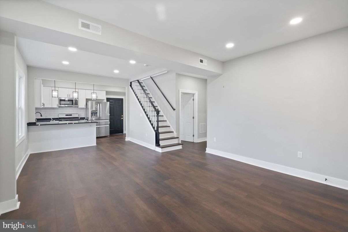 Empty room, Interior, Kitchen, Pendant Lights, Recessed Lighting, Stainless Steel Appliances, Wood Texture Flooring