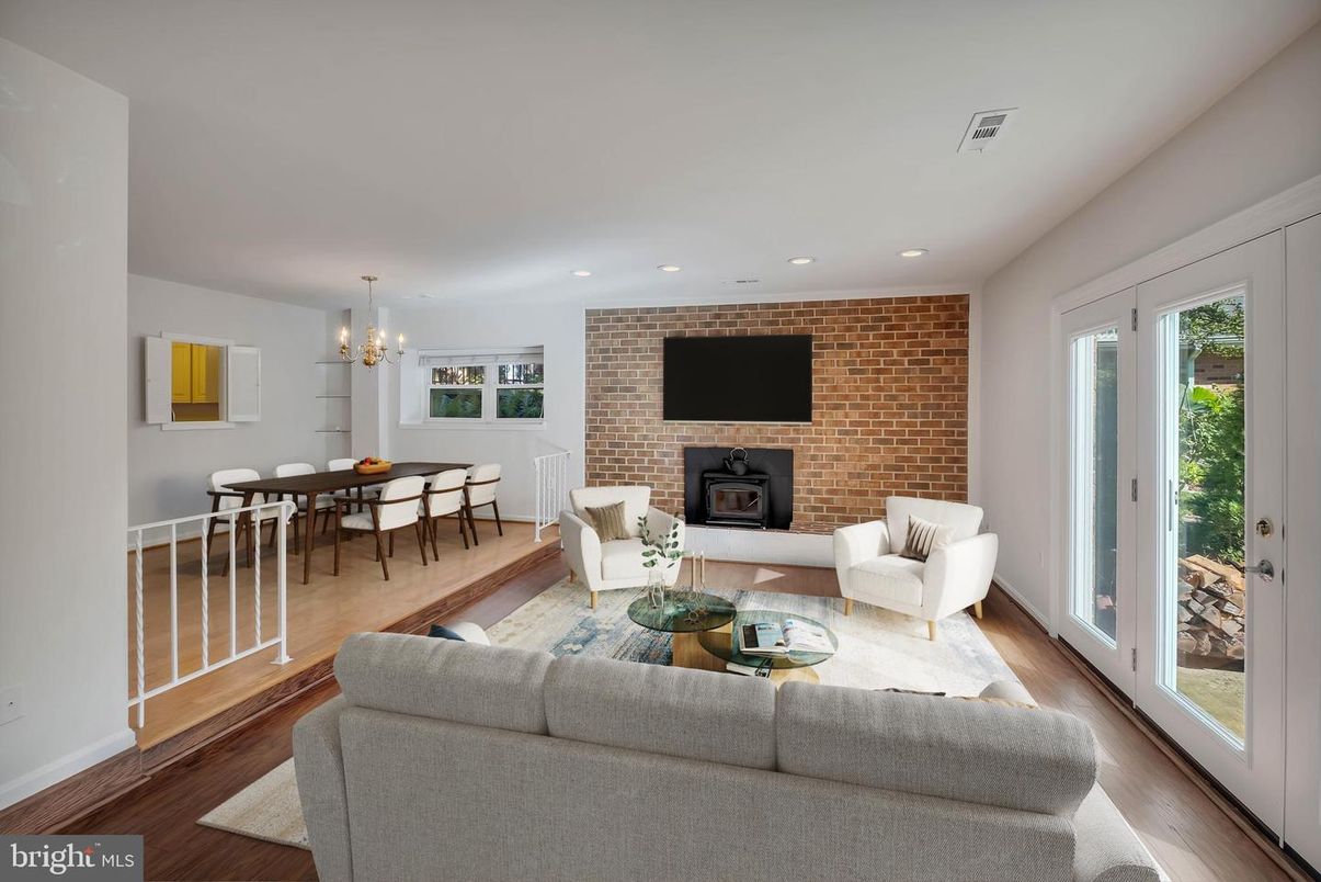 Dining room, Fireplace, Interior, Living room, Recessed Lighting, Stone Walls, Wood Texture Flooring
