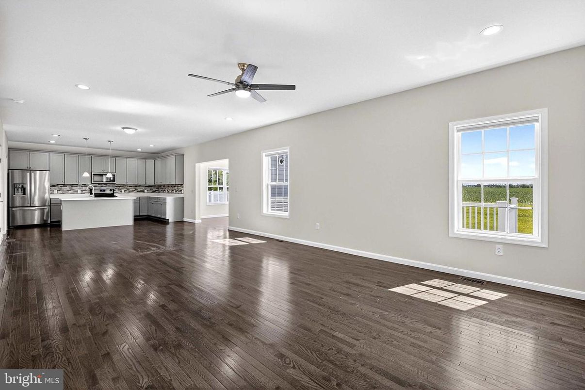 Empty room, Interior, Kitchen, Pendant Lights, Recessed Lighting, Stainless Steel Appliances, Wood Texture Flooring