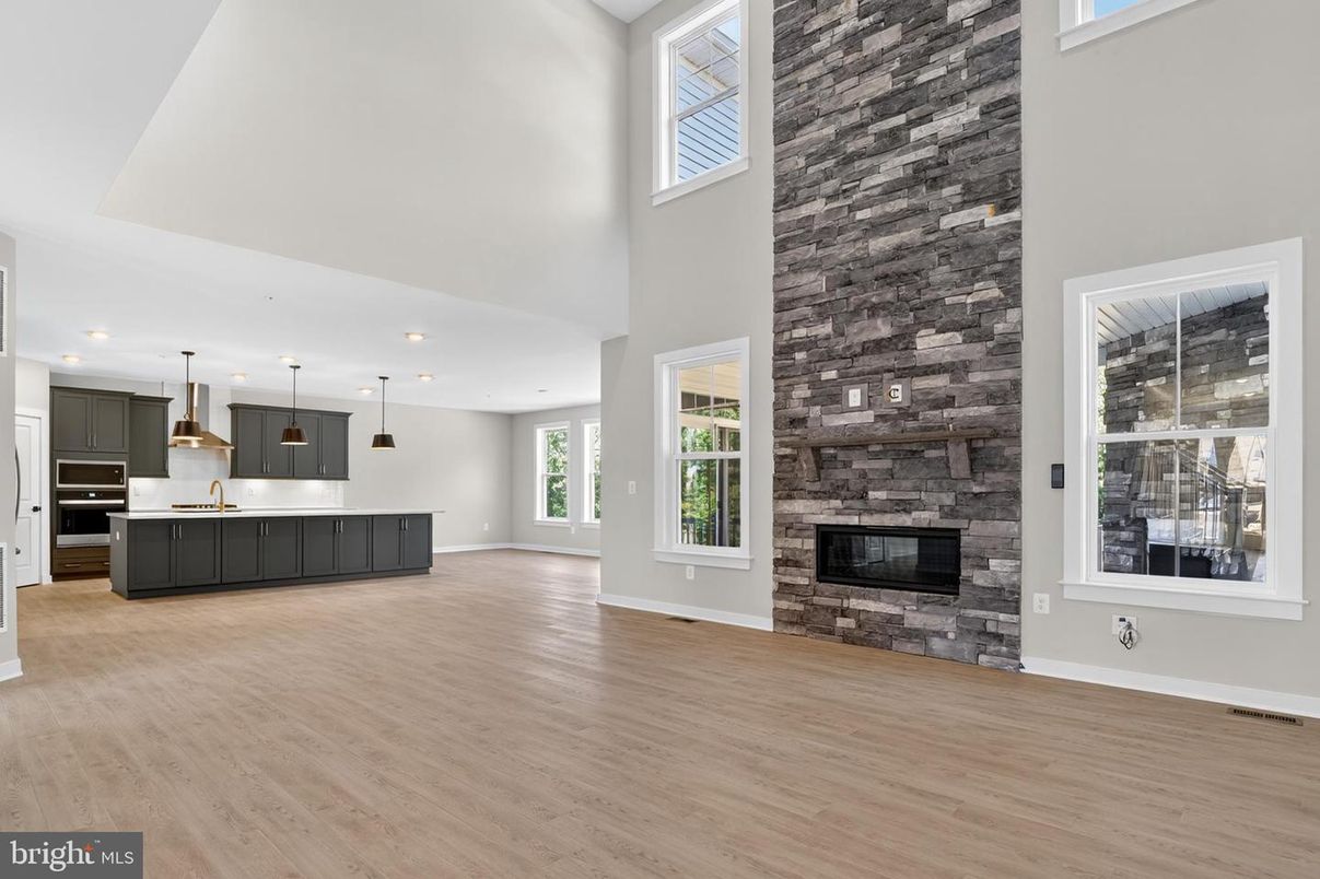 Empty room, Fireplace, Interior, Kitchen, Pendant Lights, Recessed Lighting, Wood Texture Flooring