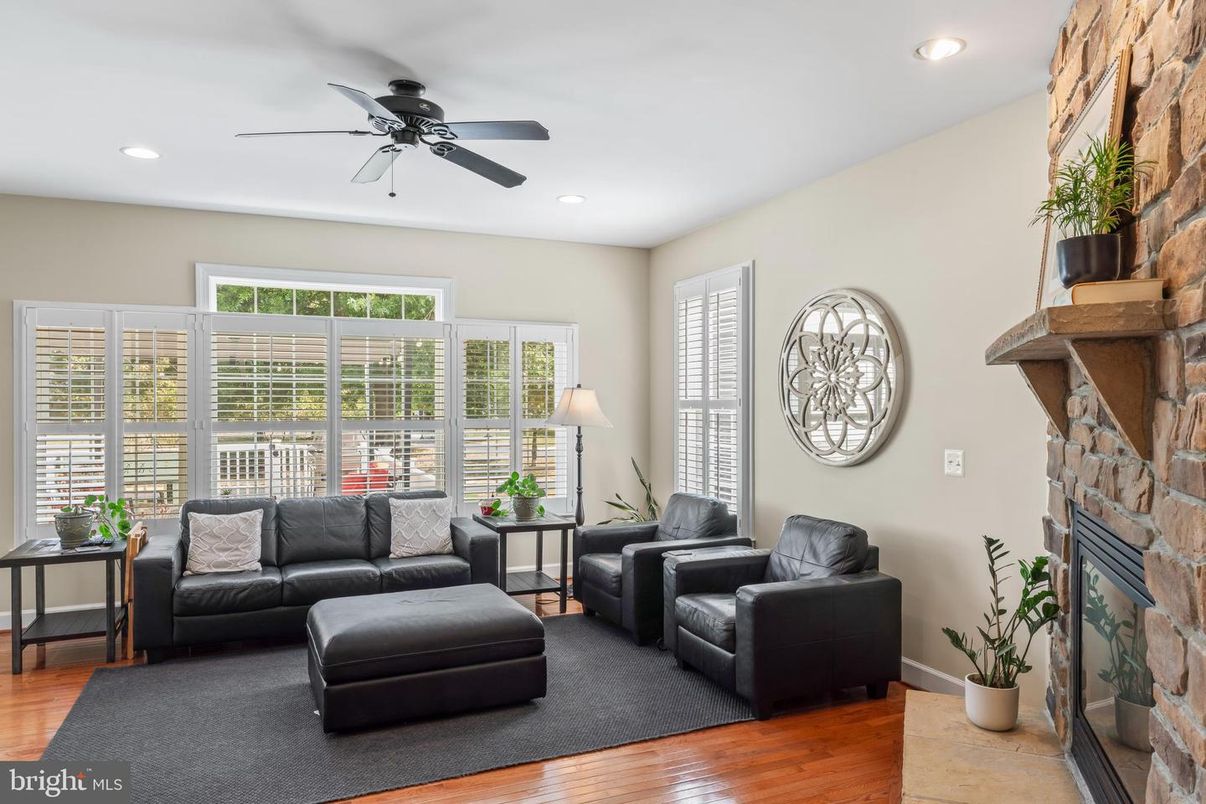 Fireplace, Interior, Living room, Recessed Lighting, Stone Walls, Wood Texture Flooring