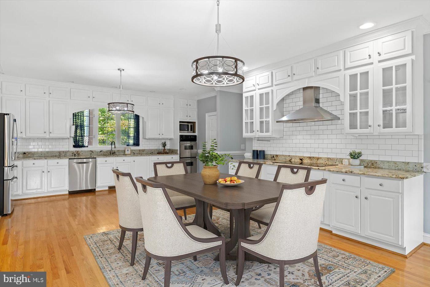 Dining room, Interior, Kitchen, Pendant Lights, Recessed Lighting, Stainless Steel Appliances, Wood Texture Flooring