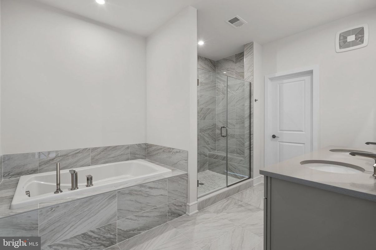 Bathroom, Dual Sink Vanities, Glass Shower, Interior, Marble, Marble Walls, Recessed Lighting