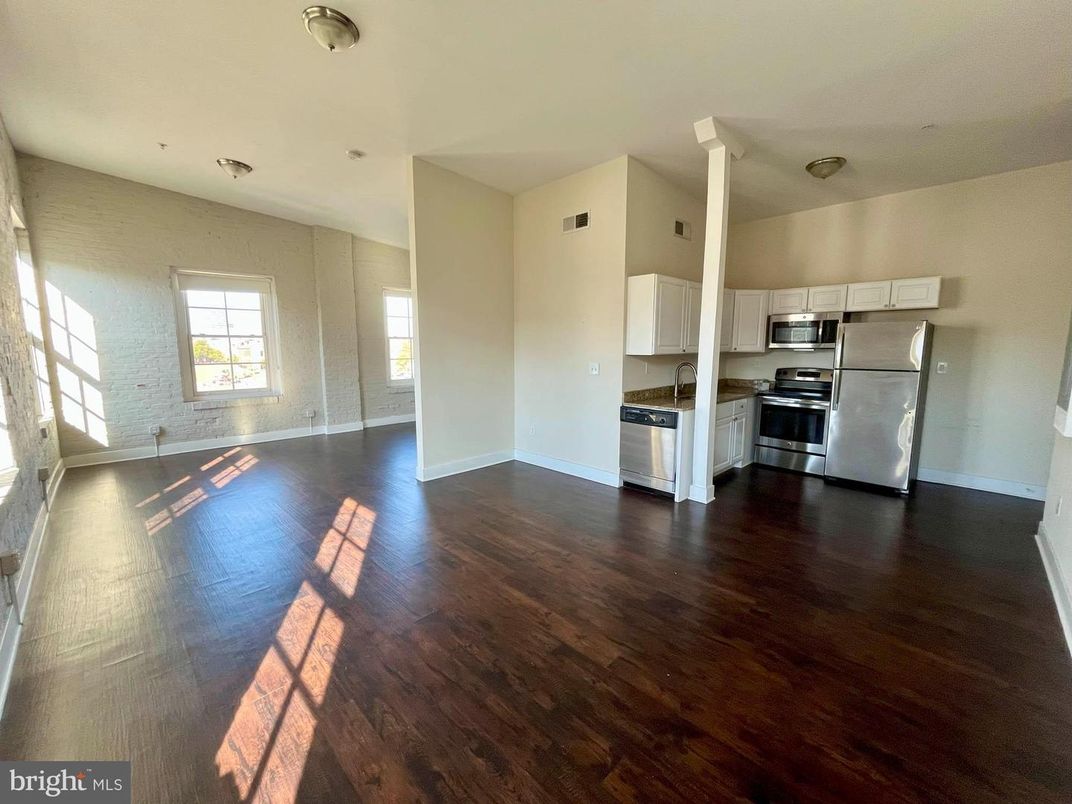Empty room, Interior, Kitchen, Stainless Steel Appliances, Wood Texture Flooring