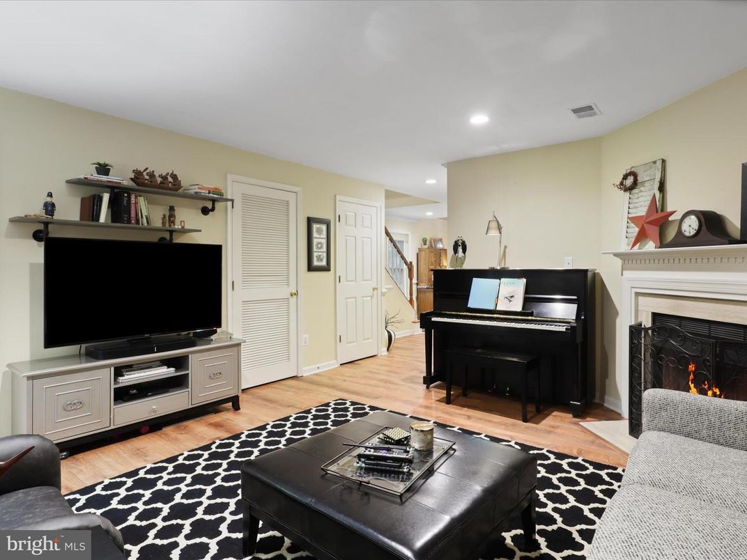 Fireplace, Interior, Living room, Piano, Recessed Lighting, Wood Texture Flooring