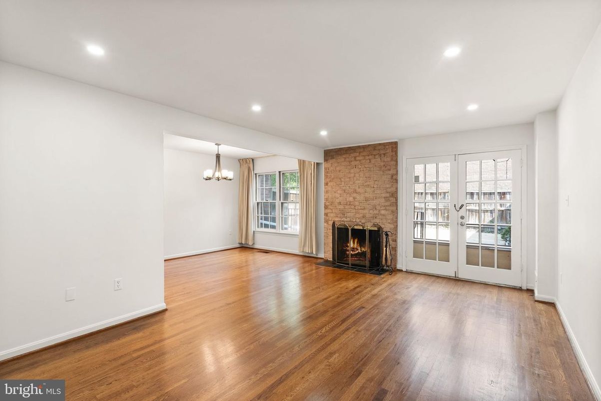 Chandelier, Empty room, Fireplace, Interior, Recessed Lighting, Stone Walls, Wood Texture Flooring
