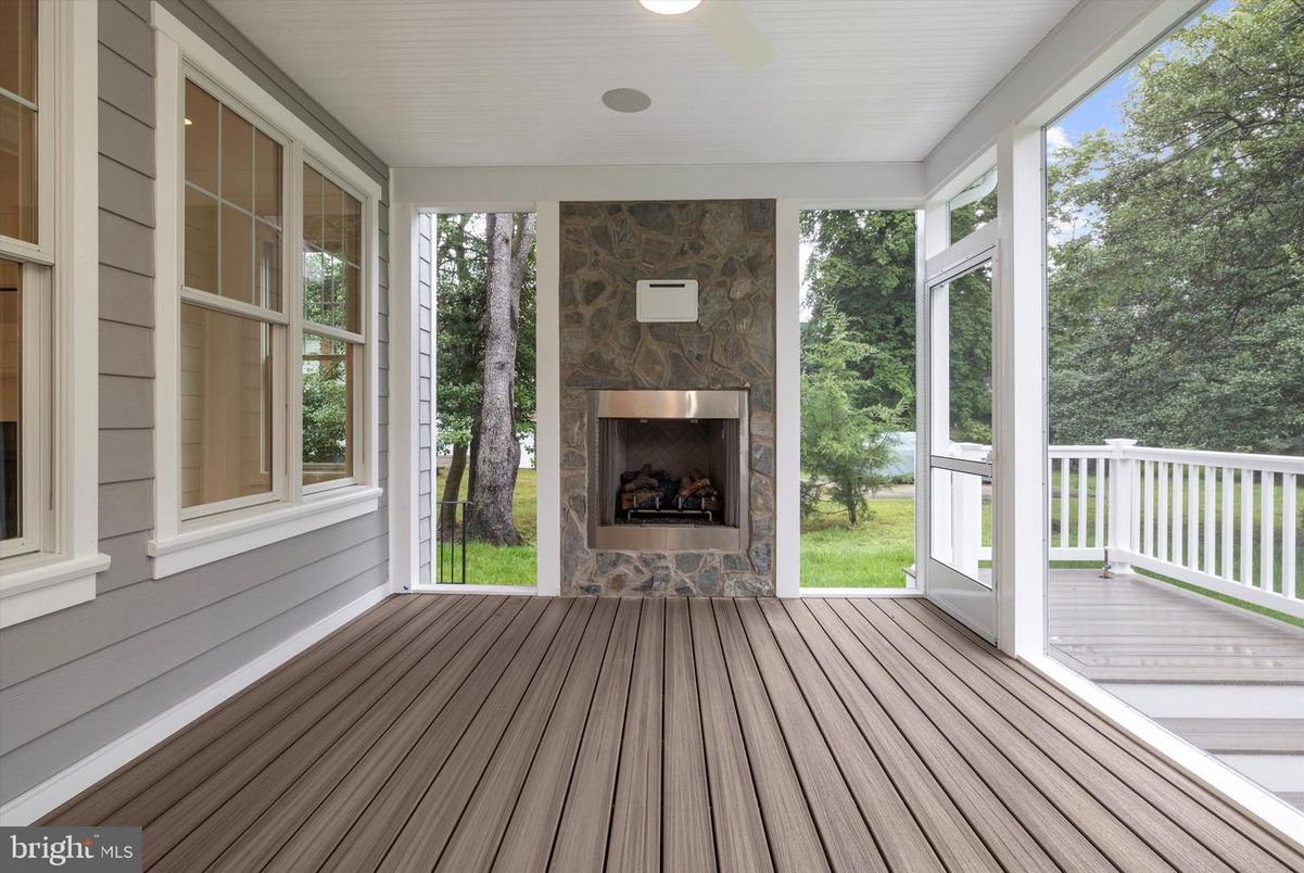Fireplace, Interior, Recessed Lighting, Sun Room, Wood Texture Flooring