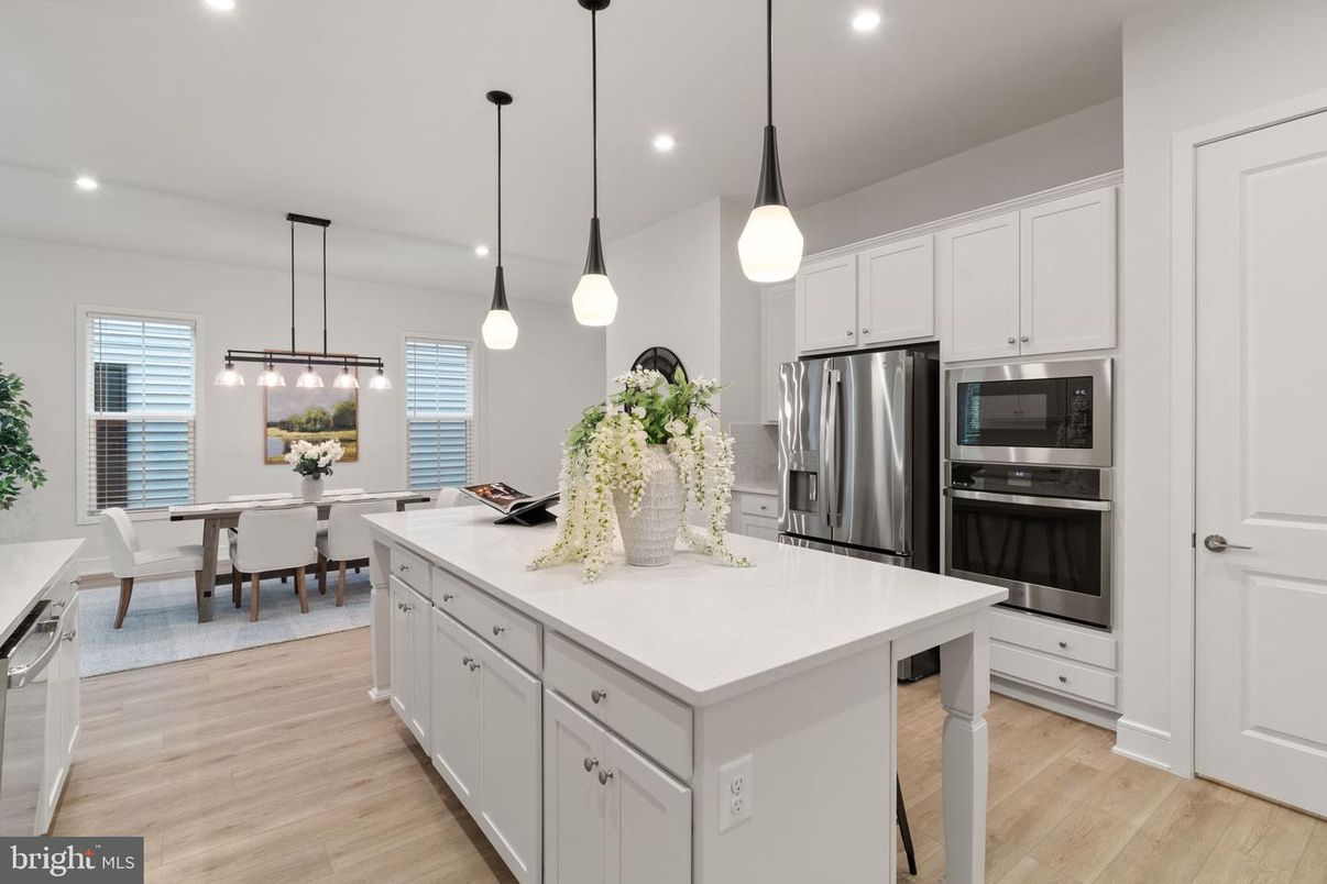 Dining room, Interior, Kitchen, Pendant Lights, Recessed Lighting, Stainless Steel Appliances, Wood Texture Flooring
