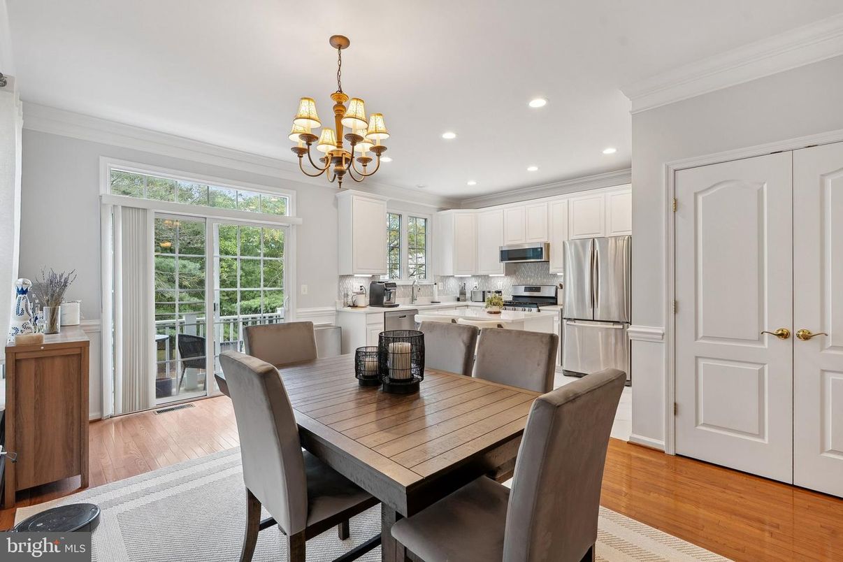 Chandelier, Dining room, Interior, Kitchen, Recessed Lighting, Stainless Steel Appliances, Wood Texture Flooring