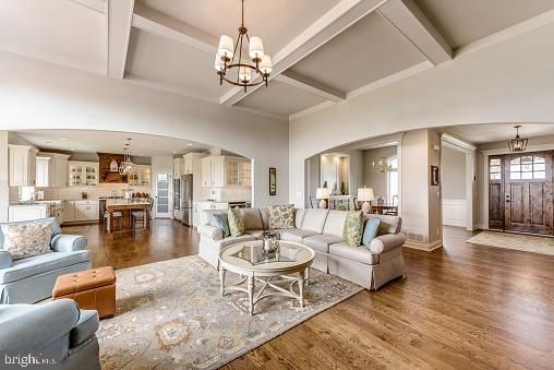 Chandelier, Dining room, Interior, Kitchen, Living room, Pendant Lights, Recessed Lighting, Stainless Steel Appliances, Wood Texture Flooring