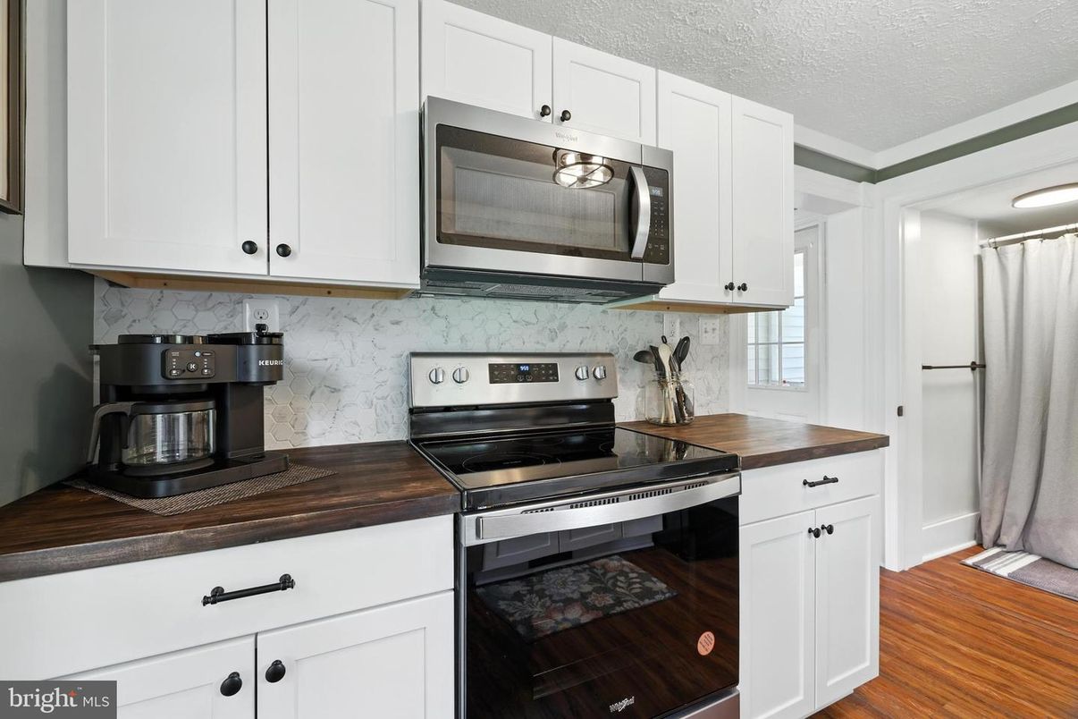 Interior, Kitchen, Marble Walls, Stainless Steel Appliances, Wood Texture Flooring