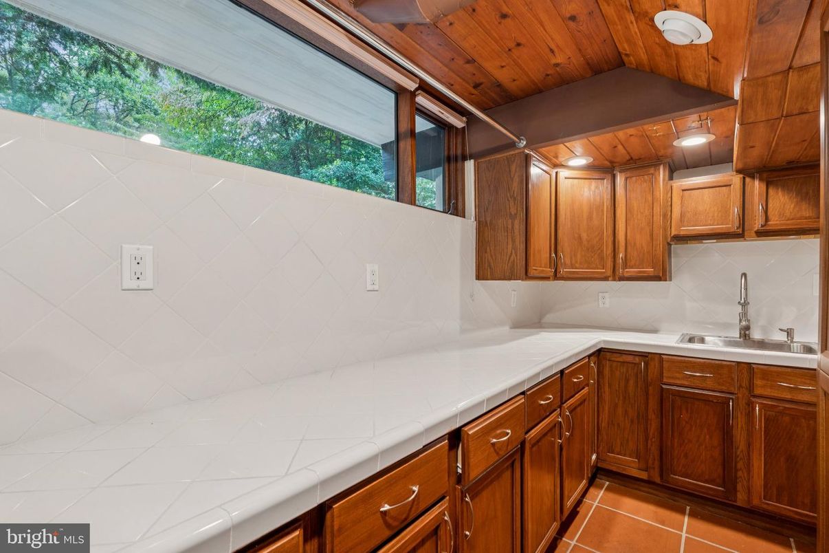 Interior, Kitchen, Recessed Lighting, Tile Countertops, Wooden Ceilings