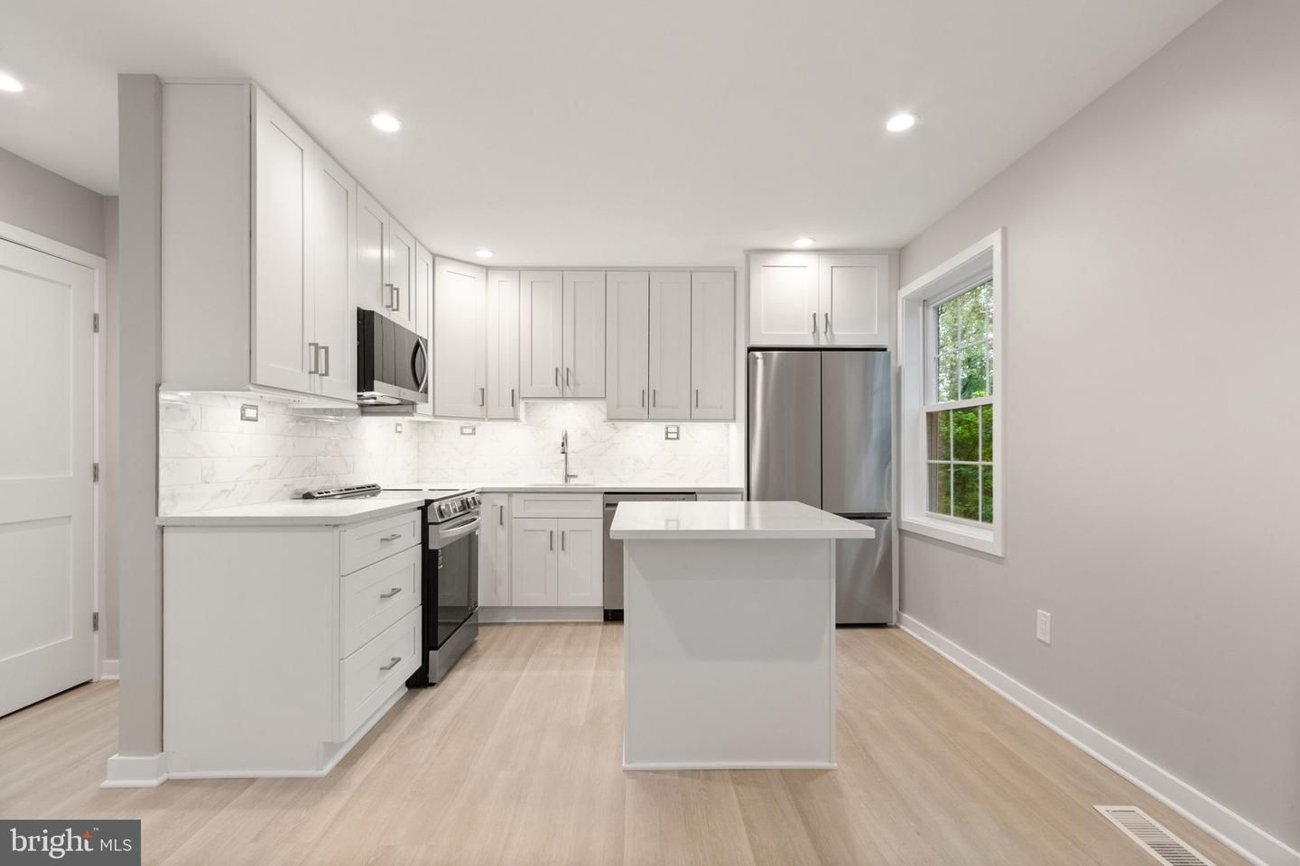 Interior, Kitchen, Marble Walls, Recessed Lighting, Stainless Steel Appliances, Wood Texture Flooring