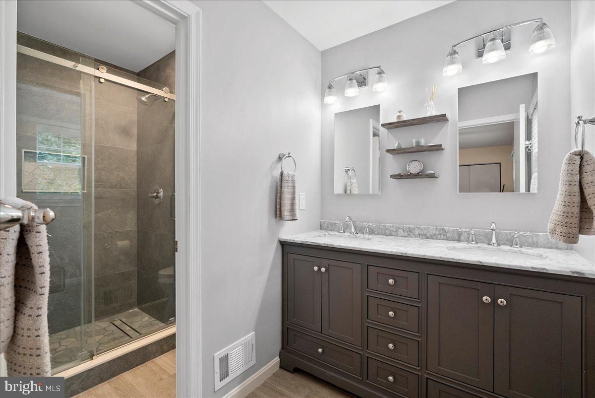 Bathroom, Dual Sink Vanities, Glass Shower, Interior, Wood Texture Flooring