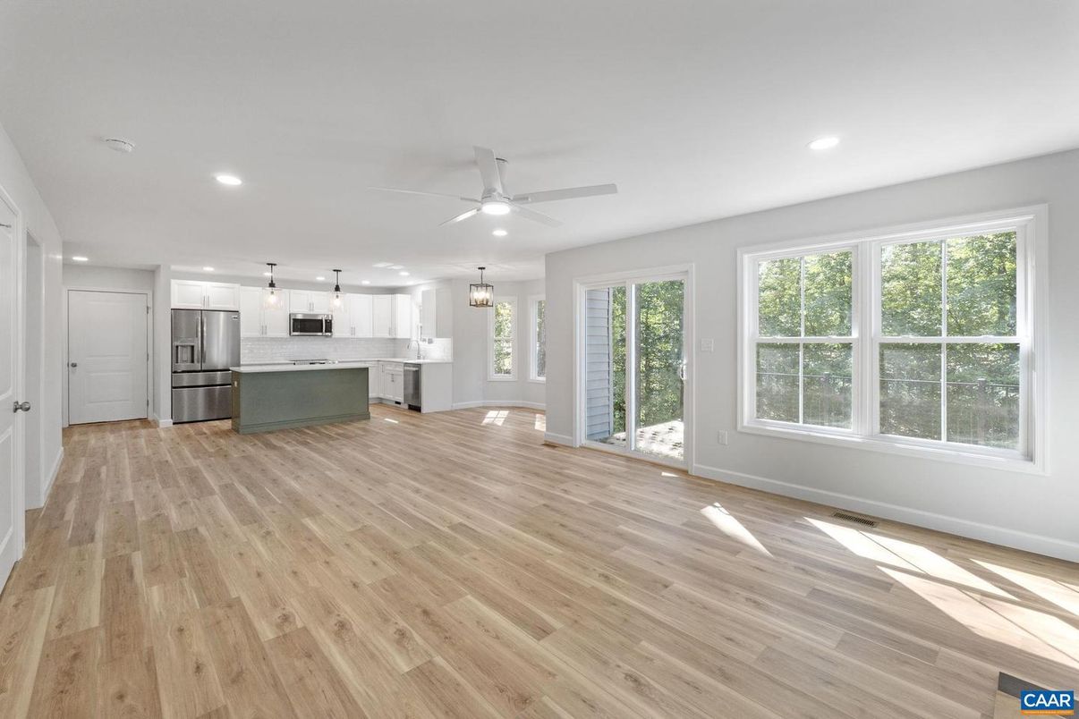 Empty room, Interior, Kitchen, Pendant Lights, Recessed Lighting, Stainless Steel Appliances, Wood Texture Flooring