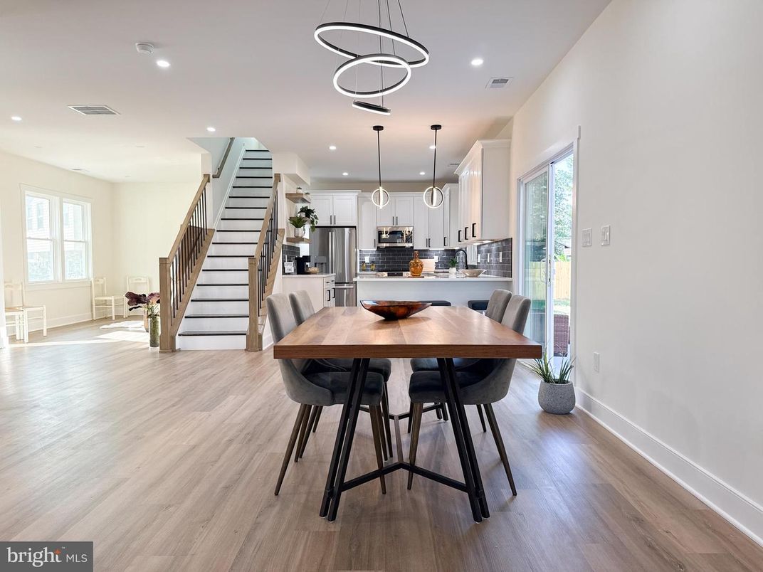 Dining room, Interior, Kitchen, Pendant Lights, Recessed Lighting, Stainless Steel Appliances, Wood Texture Flooring