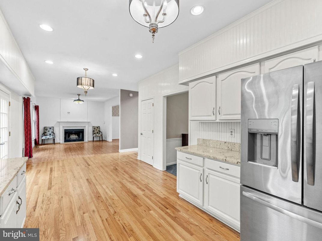 Fireplace, Interior, Kitchen, Recessed Lighting, Stainless Steel Appliances, Wood Texture Flooring