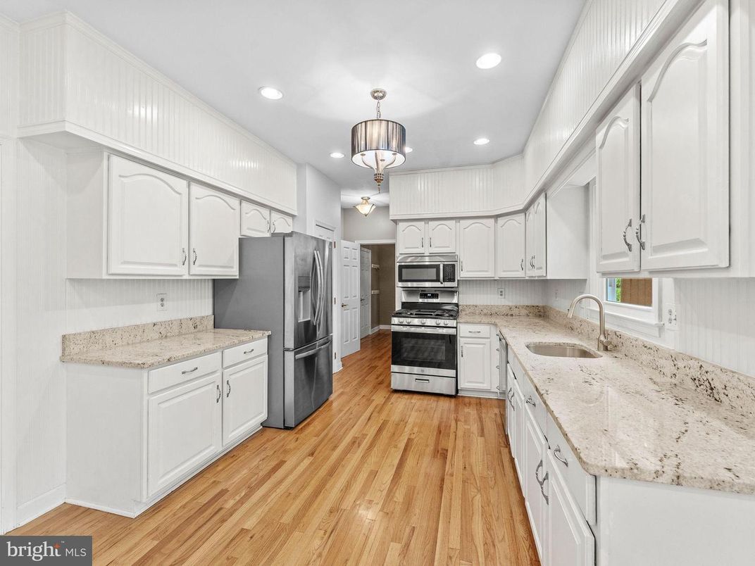 Chandelier, Interior, Kitchen, Pendant Lights, Recessed Lighting, Stainless Steel Appliances, Wood Texture Flooring