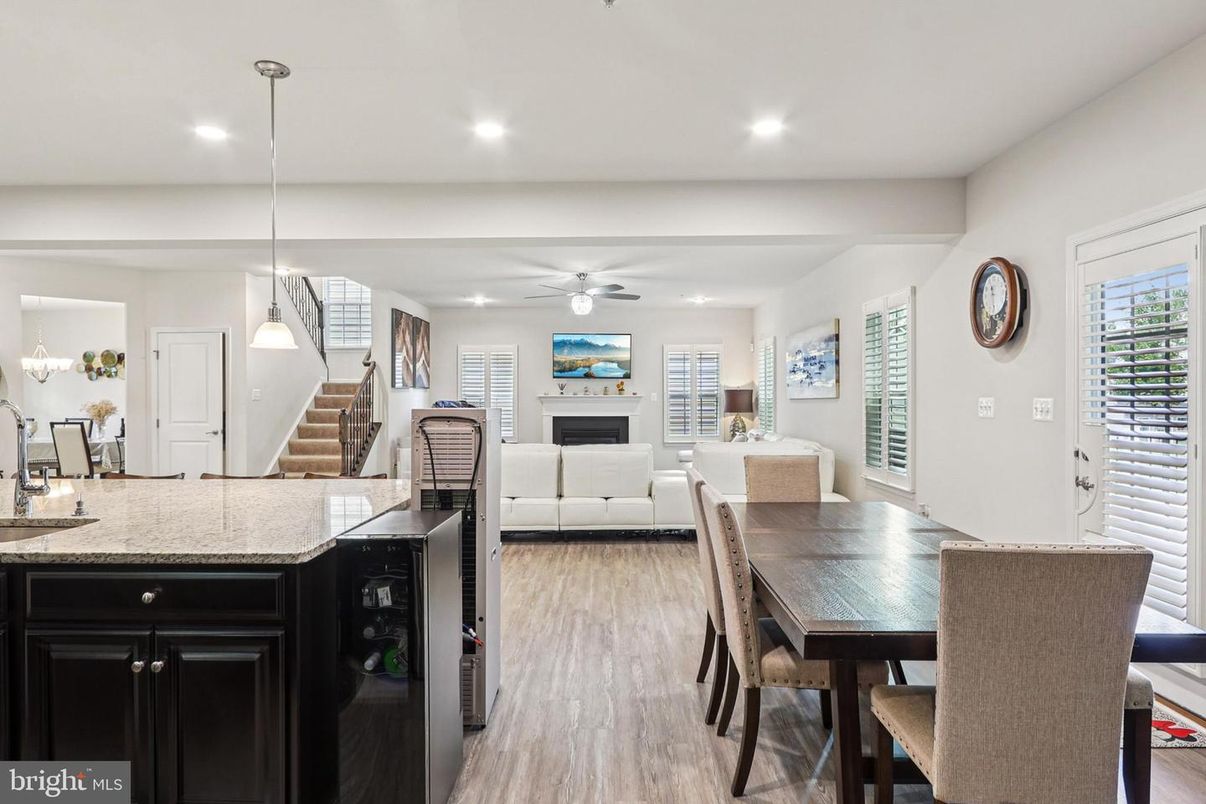 Dining room, Fireplace, Interior, Living room, Pendant Lights, Recessed Lighting, Wood Texture Flooring