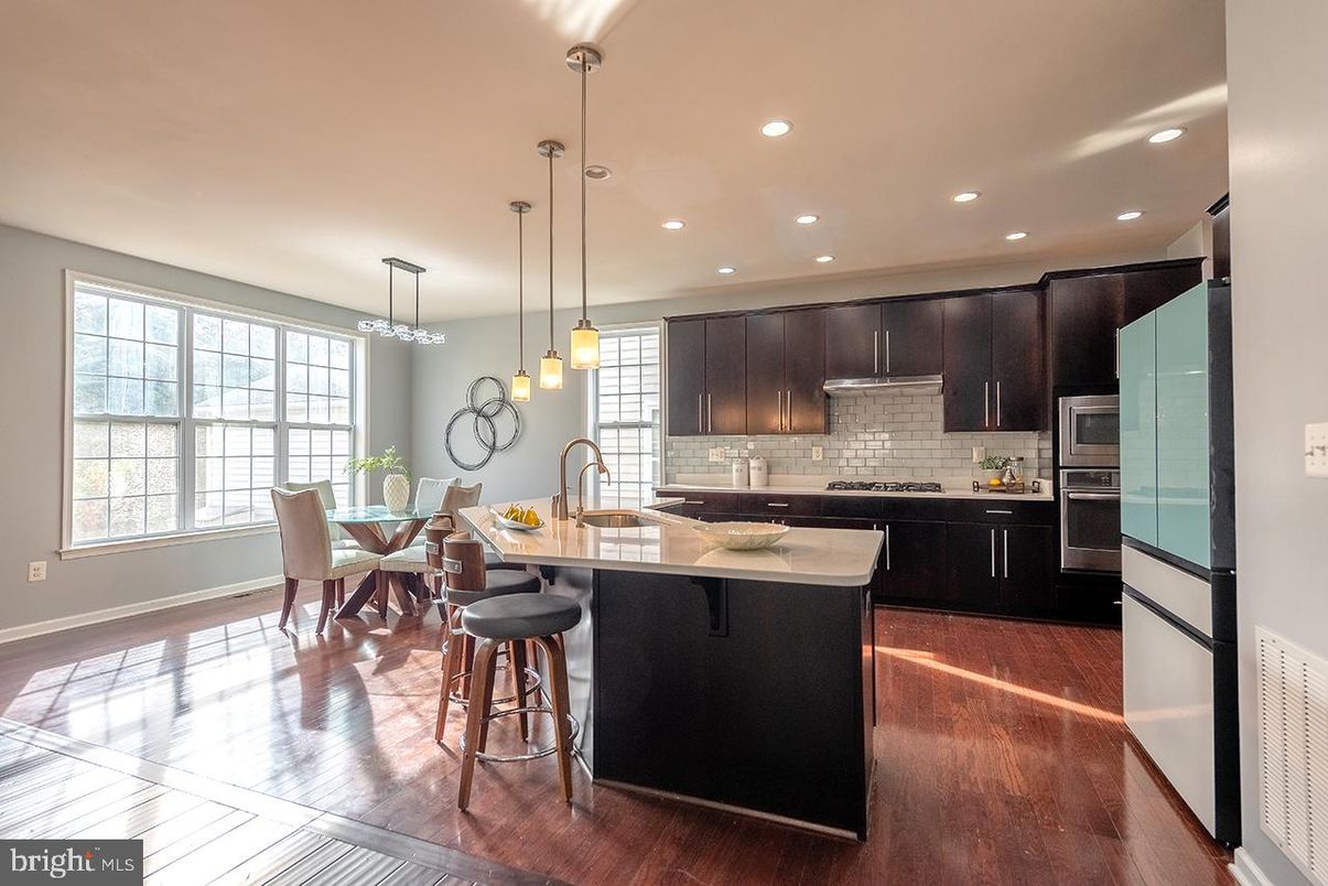 Dining room, Interior, Kitchen, Pendant Lights, Recessed Lighting, Stainless Steel Appliances, Wood Texture Flooring