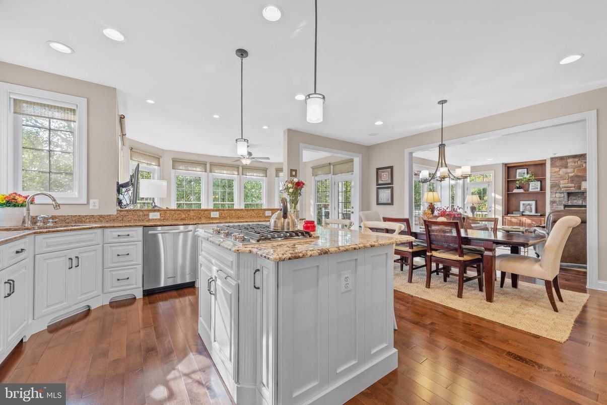 Dining room, Fireplace, Interior, Kitchen, Pendant Lights, Recessed Lighting, Stainless Steel Appliances, Wood Texture Flooring