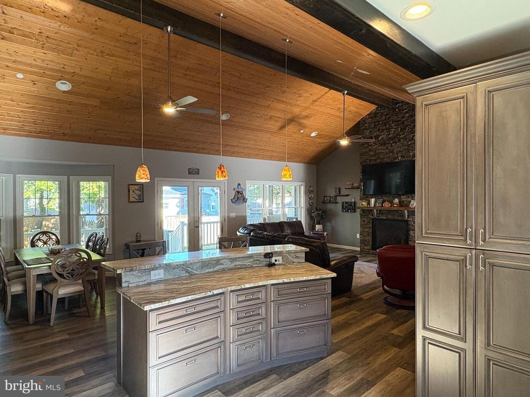 Dining room, Fireplace, Interior, Kitchen, Living room, Pendant Lights, Recessed Lighting, Wooden Beams, Wooden Ceilings, Wood Texture Flooring