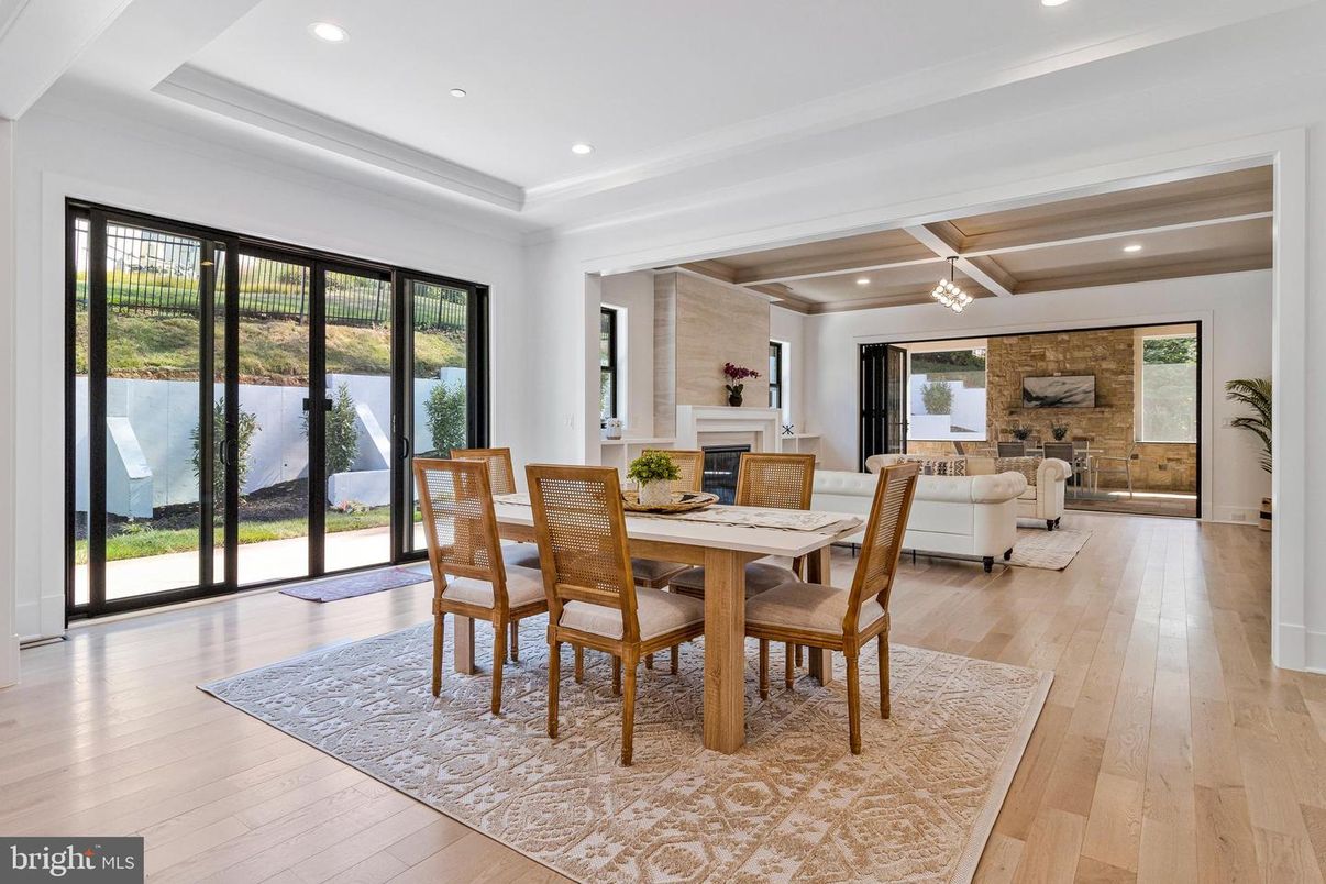 Dining room, Fireplace, Interior, Living room, Recessed Lighting, Stone Walls, Wood Texture Flooring