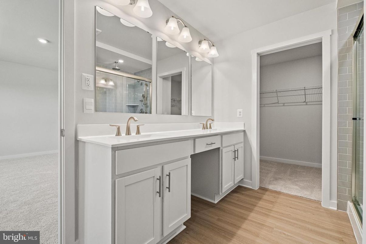 Bathroom, Dual Sink Vanities, Interior, Recessed Lighting, Walk-in Closets, Wood Texture Flooring