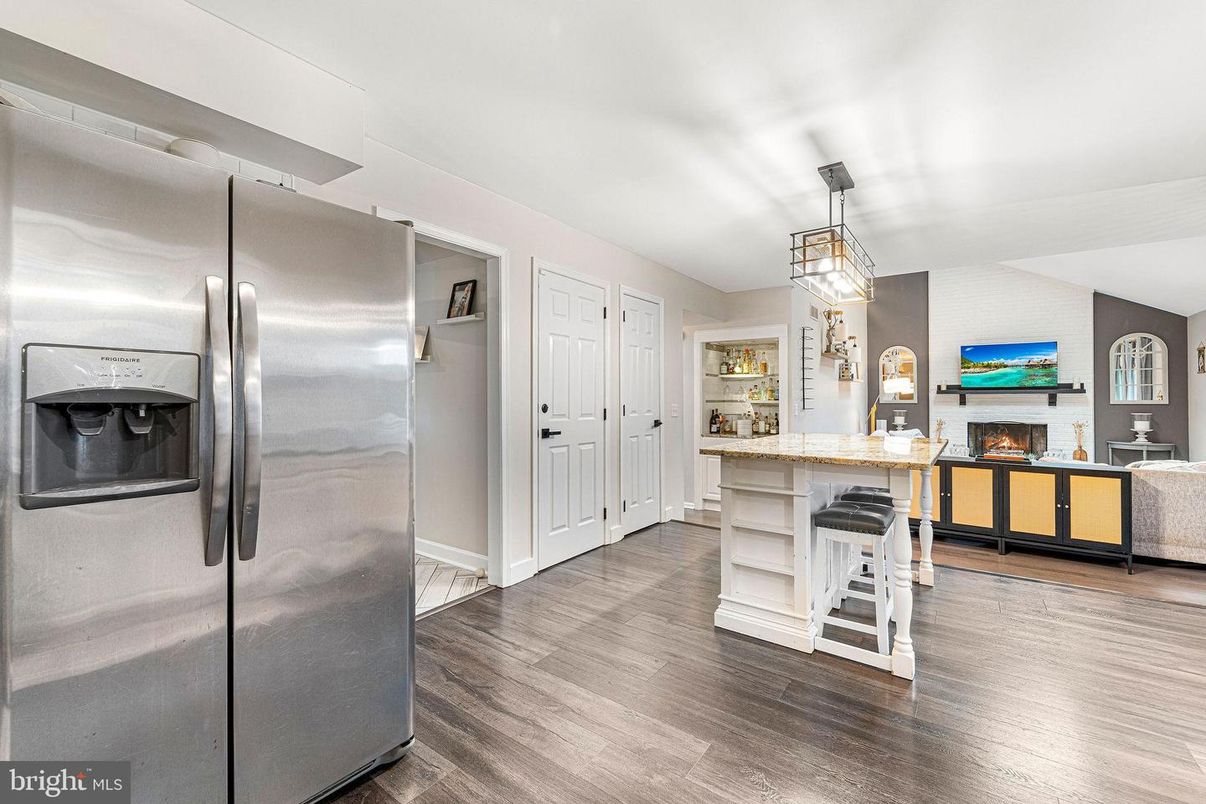 Fireplace, Interior, Kitchen, Living room, Pendant Lights, Stainless Steel Appliances, Wood Texture Flooring